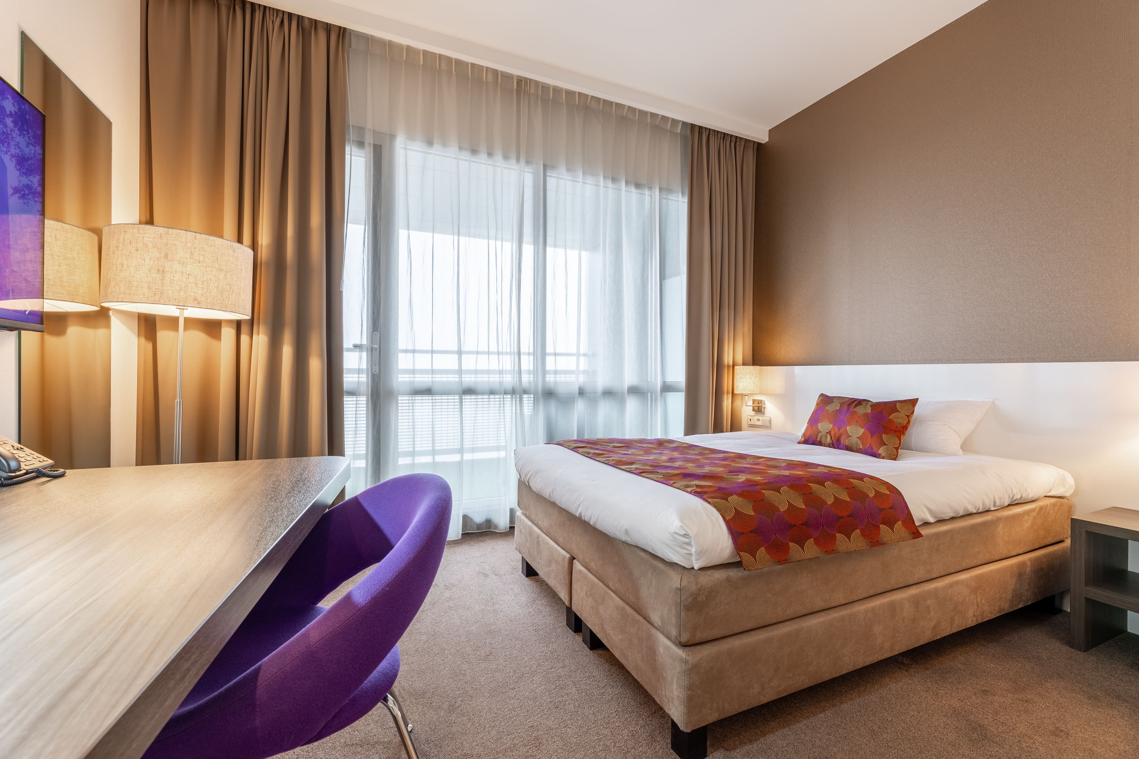 Eenpersoonskamer met balkon bij Hotel Lumen in Zwolle